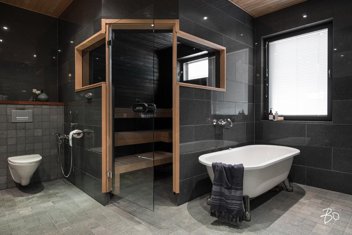 Kylpyhuone, sauna ja tassuamme muodostavat tyylikkään kokonaisuuden