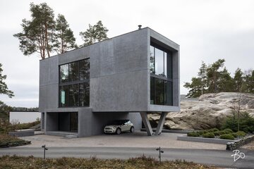 Hulppea betoniunelma minimalistisine pihoineen